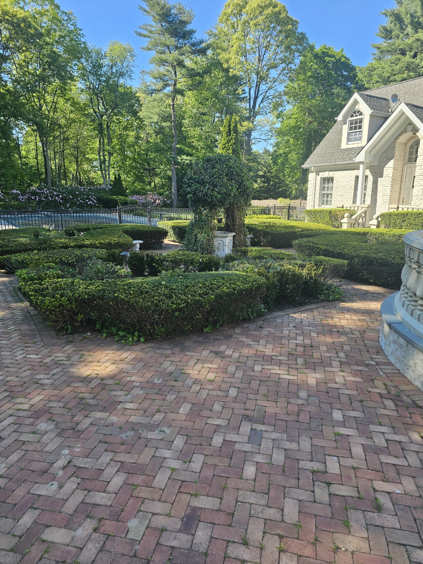 Miguel Reyes Landscaping crew installing a stone patio in a Long Island backyard